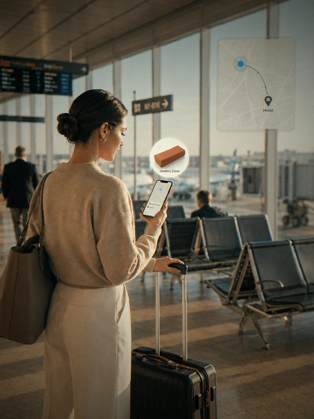 A traveller at the airport checks the box's location on her phone